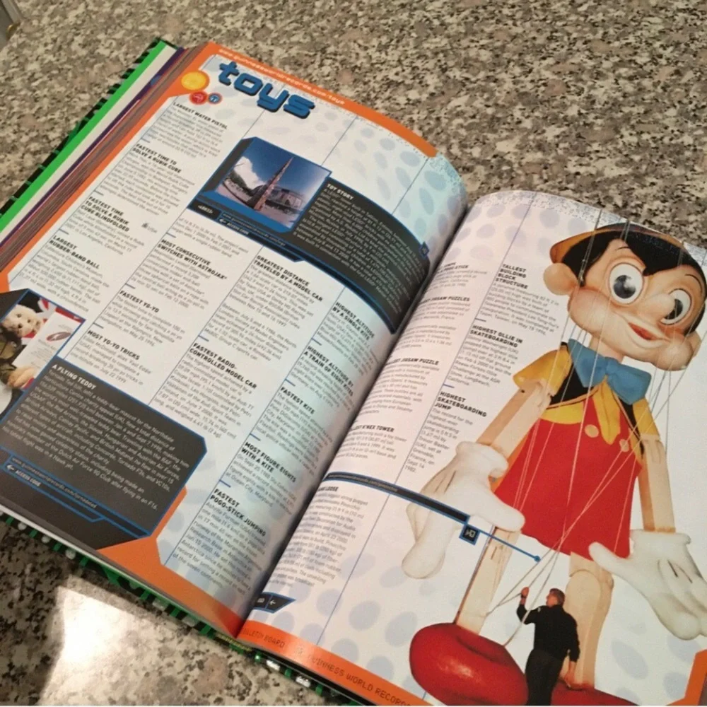 2002 book Guinness World Records hardcover photos illustrations web videos